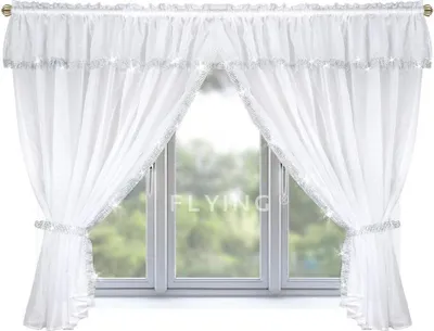 A white voile curtain set with decorative trim and tie-backs, covering a window with a blurred green outdoor view.