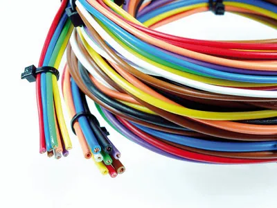 A bundle of colorful electrical wires coiled together.