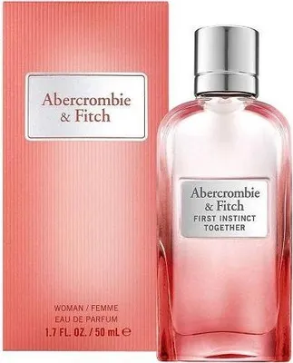 A perfume bottle and its box are displayed side-by-side against a white background.