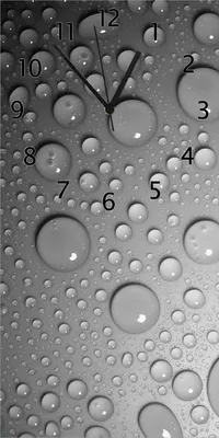 Produktbild von Wallario Design Wanduhr bedruckt, Größe 30 x 60 cm, Motiv: Wassertropfen in schwarz weiß
