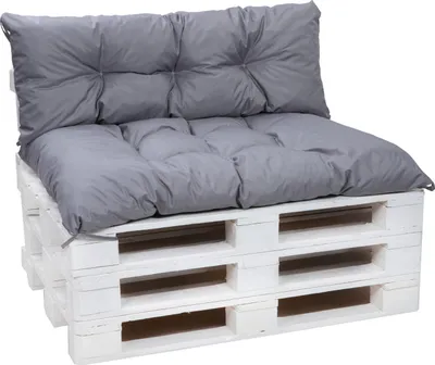 A gray cushion set for a pallet sofa, placed on a white pallet base.