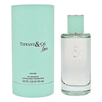 A perfume bottle and its packaging are displayed side-by-side against a white background.
