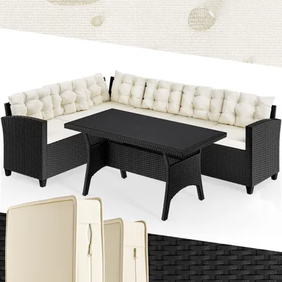 A black polyrattan corner lounge set with cream cushions and a black table, displayed on a white background.