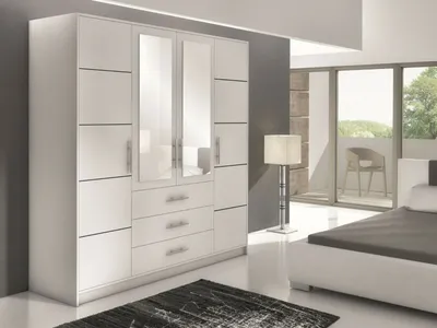 A modern bedroom scene with a large white wardrobe and a bed.