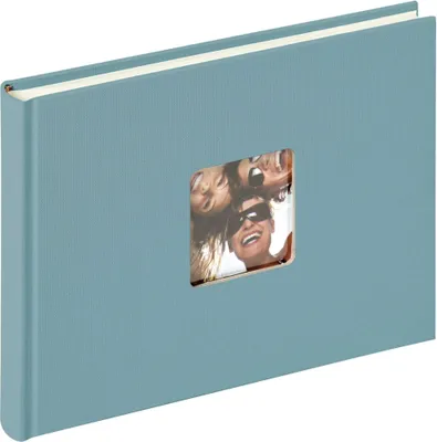 A blue photo album with a window on the cover showing a picture of three people.