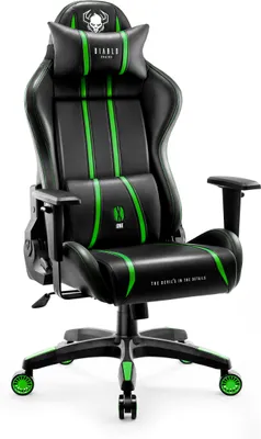 A black and green gaming chair against a white background.
