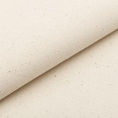 A close-up, diagonal view of a piece of beige fabric, folded over itself.