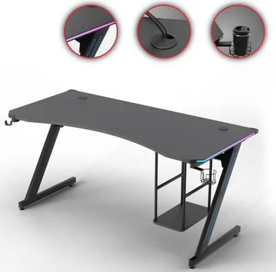 A gaming desk with LED lighting and accessories.
