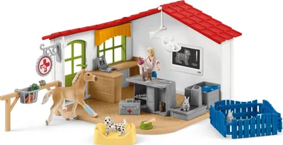 A toy veterinary clinic playset with various animal figures and accessories.