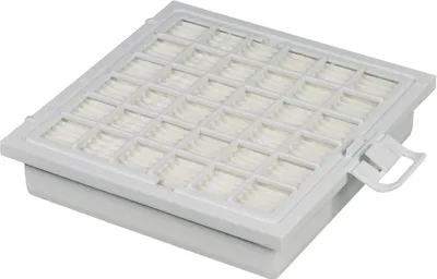 A white air filter cassette with a grid pattern on top and a handle on the side.
