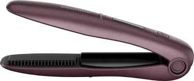 A close-up, side view of a purple hair straightener on a white background.