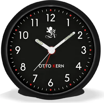 A close-up studio shot of a black analog alarm clock with white hands and numbers.