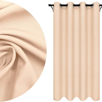 A close-up of fabric texture and a beige curtain hanging on a rod.