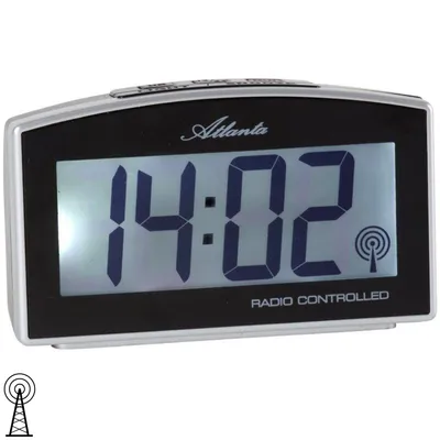 A digital alarm clock with a silver and black casing is shown against a white background.