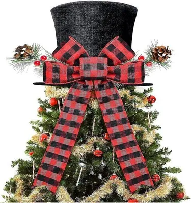 Image de Chapeau noir de Noël avec un nœud rayé et une sucette
