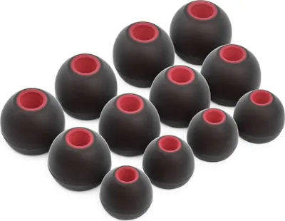 A collection of black ear tips with red inner lining, arranged in rows.