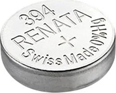 A close-up, slightly angled shot of a silver coin-cell battery.