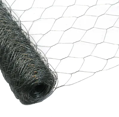 A roll of hexagonal wire mesh, also known as chicken wire, is shown against a white background. The mesh is partially unrolled, revealing its hexagonal pattern and the tightly wound coil of wire.