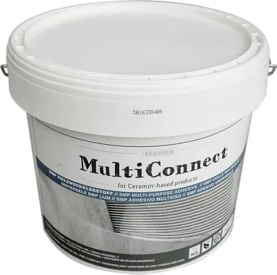 A white bucket of adhesive with a label.