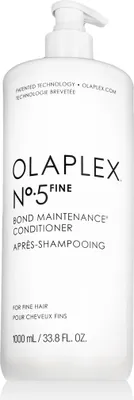 A white bottle of Olaplex No.5 Bond Maintenance Conditioner for fine hair with a pump dispenser.