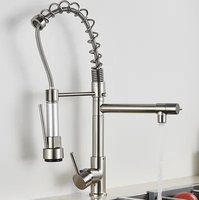 A close-up shot of a modern kitchen faucet with a pull-down sprayer, set against a plain white background.