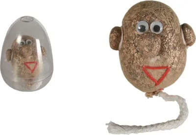 Two novelty items, one inside a clear plastic egg-shaped container and the other outside, both depicting a face with googly eyes and a red triangle mouth.