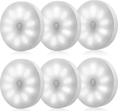 A set of six white, round LED lights with motion sensors, arranged in two rows of three.