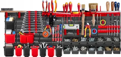 A well-organized tool wall with various tools and storage bins.
