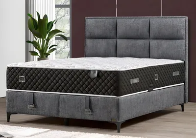 Image de Elégant lit gris avec matelas en bois et textile