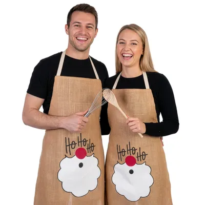 Produktbild von BRUBAKER Schürze Ho Ho Ho Weihnachtsmann Bart - Kochschürze Weihnachten - Unisex Küchenschürze für Damen und Herren - One Size Weihnachtsschürze aus Jute - Braun - Juteschürze
