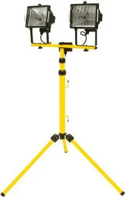 A yellow tripod with two halogen floodlights mounted on top.