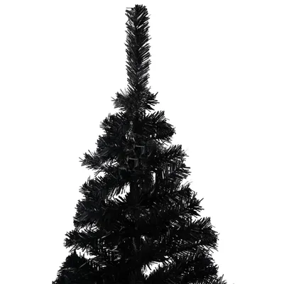 A close-up view of the top section of a black artificial Christmas tree.