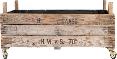 A wooden planter box with wheels, featuring text markings.
