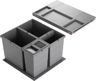 A gray built-in trash can system with multiple compartments and a pull-out drawer is shown against a white background.