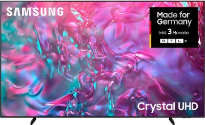 A Samsung Crystal UHD TV displaying a colorful abstract image, with promotional text in the upper right corner.