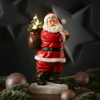 LED Weihnachtsmann mit leuchtendem Tannenbaum - Dekofigur aus Polyresin - H: 30cm - Batteriebetrieb
