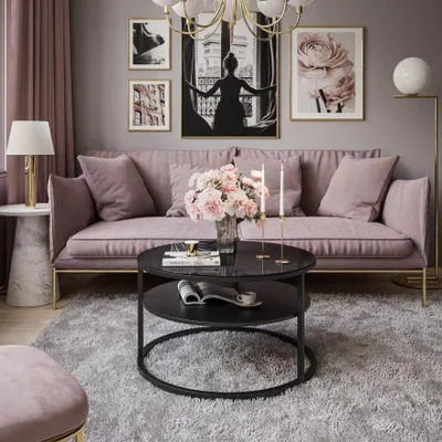 A living room scene with a pink couch, coffee table, and decor.