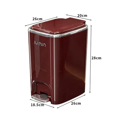 A red pedal trash can with dimensions indicated.