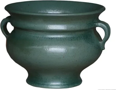 A green ceramic pot with handles, shown against a white background.