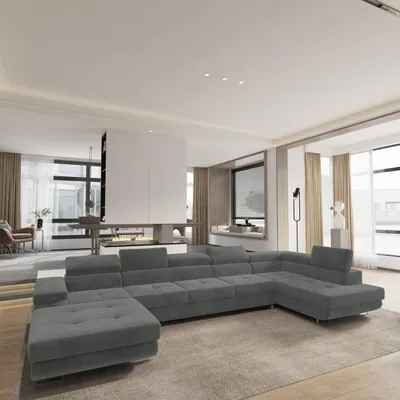 A spacious, modern living room with a large sectional sofa as the focal point.