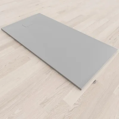 A flat, gray shower tray is placed on a light wood-look floor.