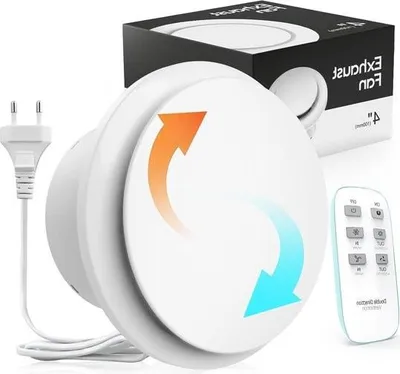A white bathroom fan with a remote control and power plug, presented with its packaging in the background.