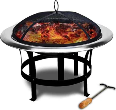 A fire pit with a mesh spark screen and a fire poker.