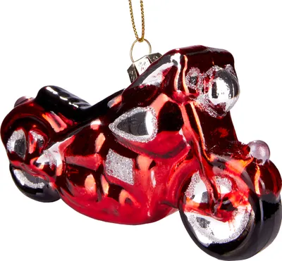 A red motorcycle ornament hanging from a gold chain against a white background.