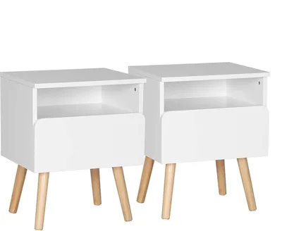 Two white nightstands with wooden legs are shown against a white background.