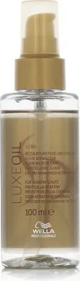 A clear, professional studio shot of a Wella SP Luxe Oil Elixir bottle against a white background.