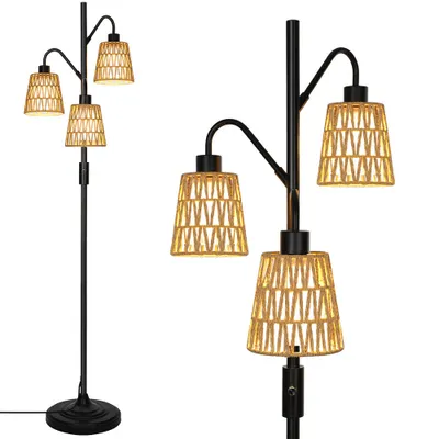 A floor lamp with three rattan lampshades is shown against a white background.