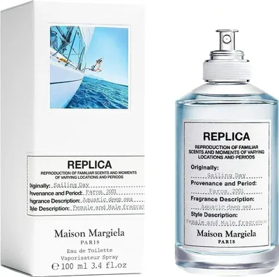 A Maison Margiela Replica Sailing Day Eau de Toilette bottle and its packaging are displayed side-by-side against a white background.