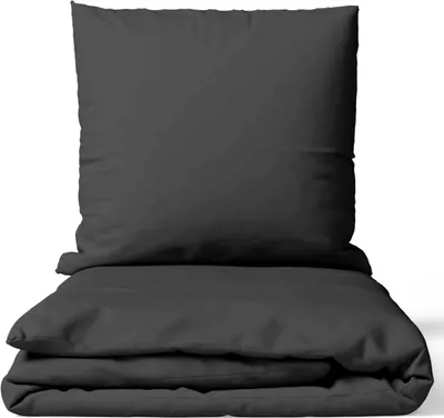 A folded duvet and pillow on a white background.