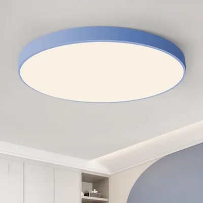 A round LED ceiling light with a blue rim is mounted on a white ceiling.